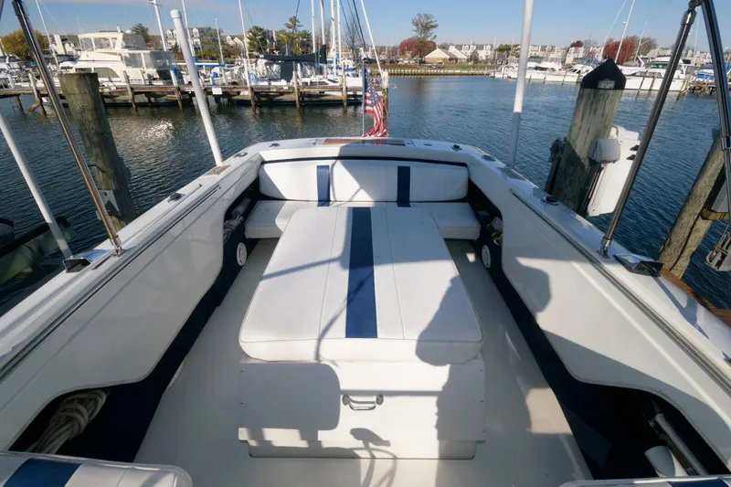Slide: The Image of 1972 Chris-Craft Lancer 23 boat interior at a marina with white and blue seating. - 11
