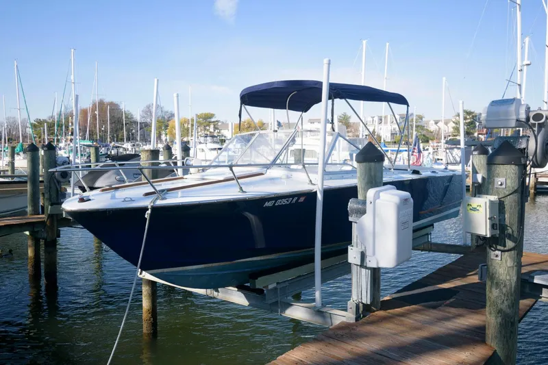 Slide: The Image of 1972 Chris-Craft Lancer 23 boat docked at a marina. - 3