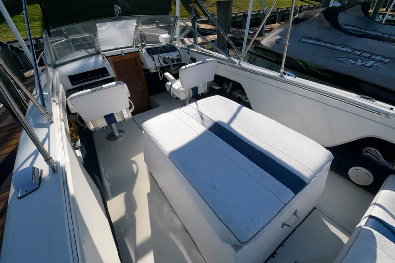 Slide: The Image of 1972 Chris-Craft Lancer 23 boat interior with white and blue seating. - 4