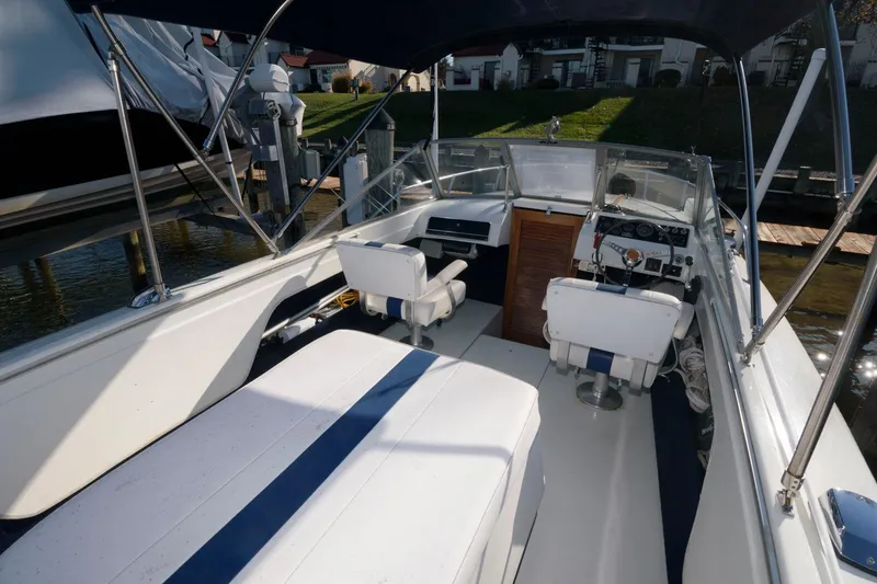 Slide: The Image of 1972 Chris-Craft Lancer 23 boat interior with white and blue seating. - 7