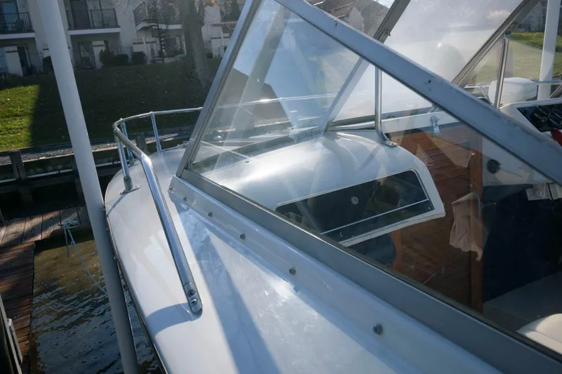 Slide: The Image of 1972 Chris-Craft Lancer 23 boat docked, close-up of windshield and deck. - 9