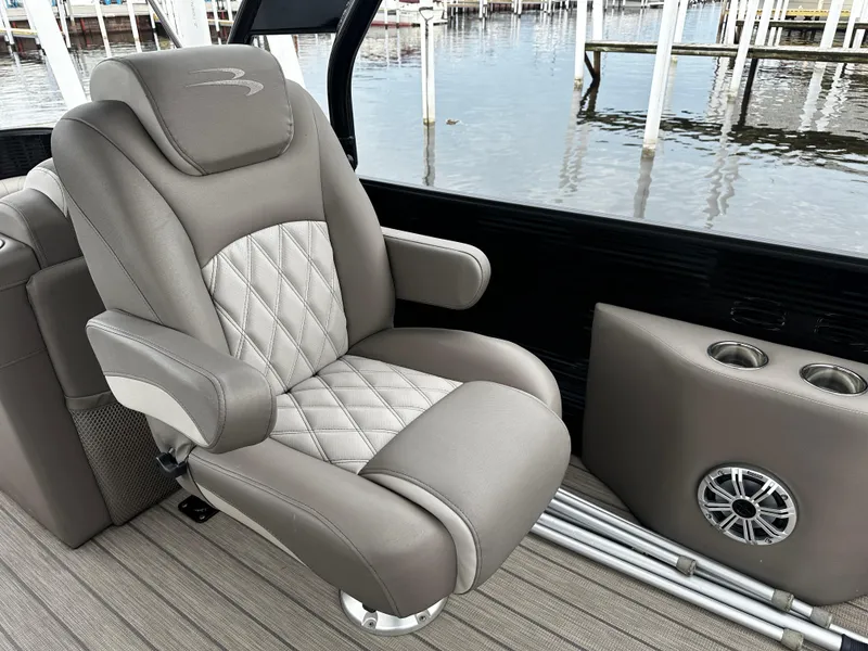 Slide: The Image of Luxurious seating on a 2018 Bennington G25 pontoon boat with diamond-stitched upholstery. - 4