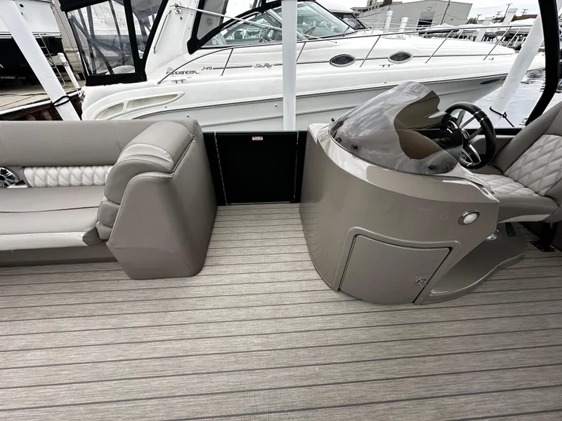 Slide: The Image of 2018 Bennington G25 boat interior with helm and seating area. - 5