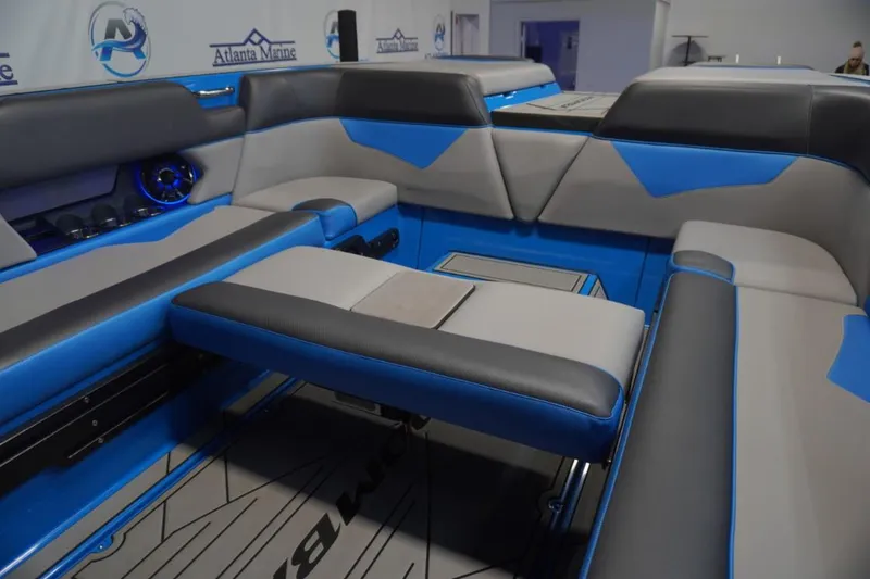 Slide: The Image of Interior of 2021 Moomba Makai with blue and gray seating. - 10