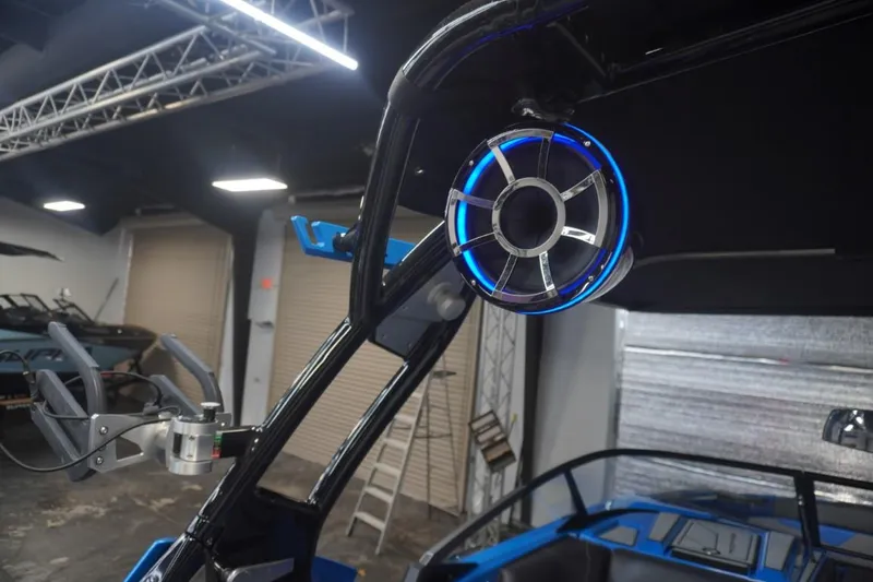 Slide: The Image of 2021 Moomba Makai boat with blue illuminated speaker. - 12