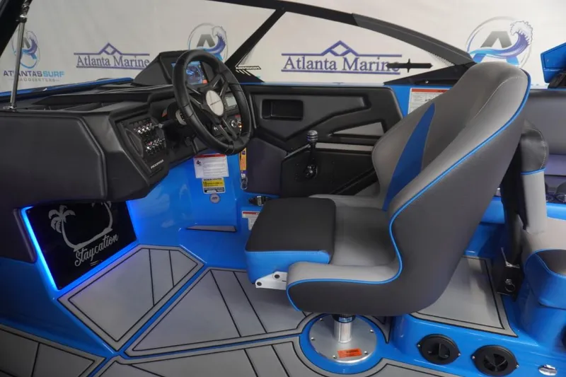 Slide: The Image of Interior of a 2021 Moomba Makai boat with blue and gray design. - 15