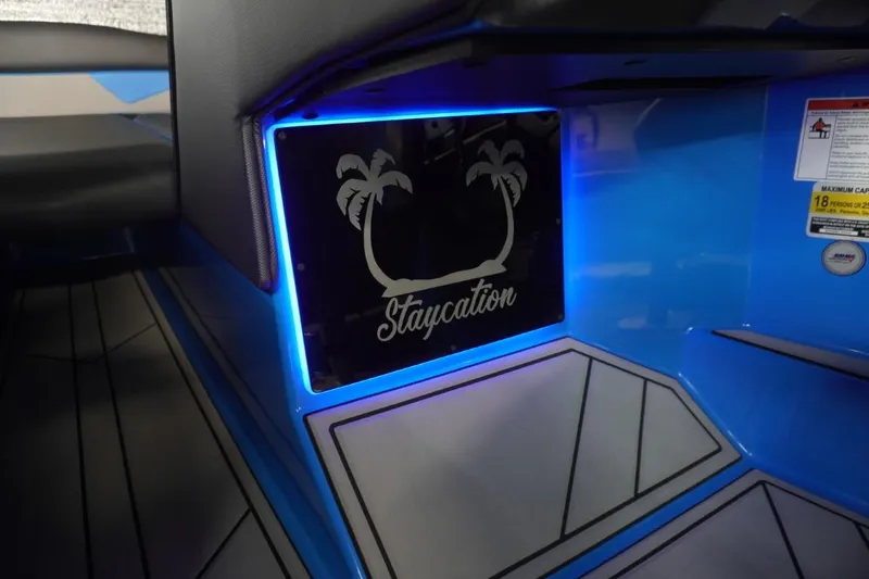 Slide: The Image of Interior of 2021 Moomba Makai with illuminated "Staycation" sign. - 22
