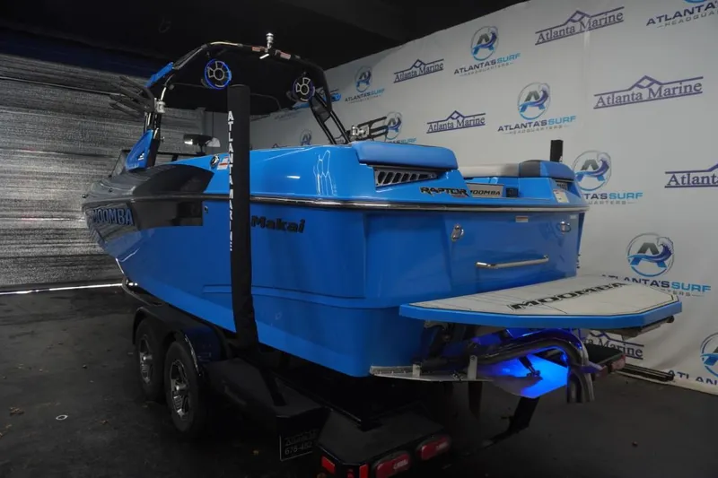 Slide: The Image of 2021 Moomba Makai boat in bright blue, Atlanta Marine backdrop. - 3