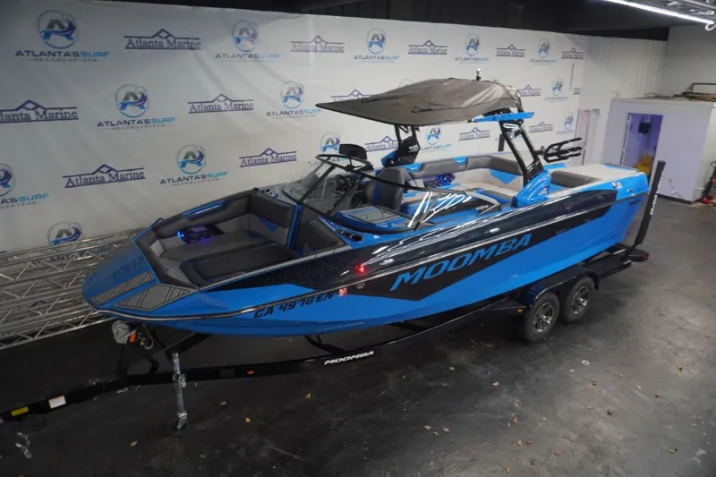 Slide: The Image of 2021 Moomba Makai boat in a showroom. - 5