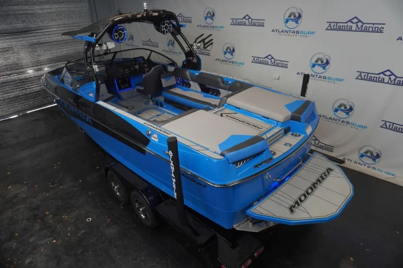 Slide: The Image of 2021 Moomba Makai boat in a showroom. - 6
