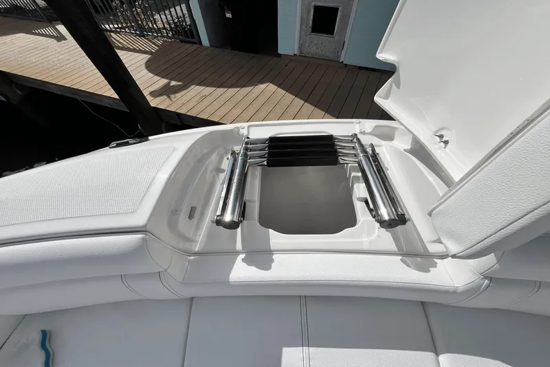Slide: The Image of 2019 Sea Ray SDX 270 Outboard boat with open storage compartment and stainless steel ladder. - 24