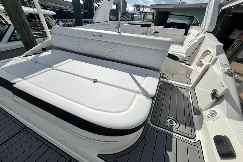 Slide: The Image of 2019 Sea Ray SDX 270 Outboard boat with white seating and black accents. - 6