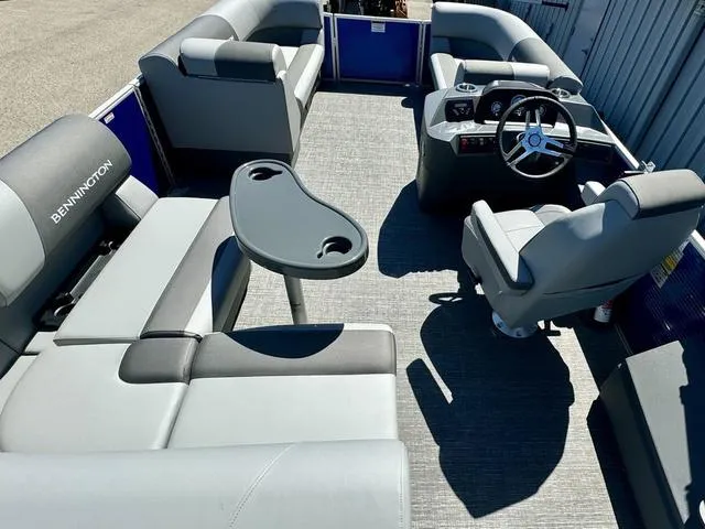 Slide: The Image of 2024 Bennington 20 SVF pontoon boat interior with seating and steering console. - 11