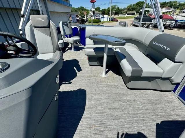 Slide: The Image of 2024 Bennington 20 SVF pontoon boat interior with seating and table. - 12
