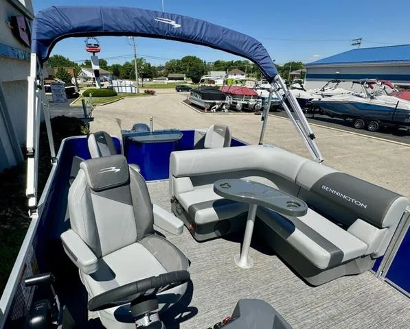 Slide: The Image of 2024 Bennington 20 SVF pontoon boat interior with seating and table. - 13
