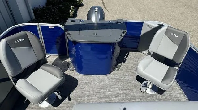 Slide: The Image of 2024 Bennington 20 SVF pontoon boat interior with two grey seats and blue accents. - 15