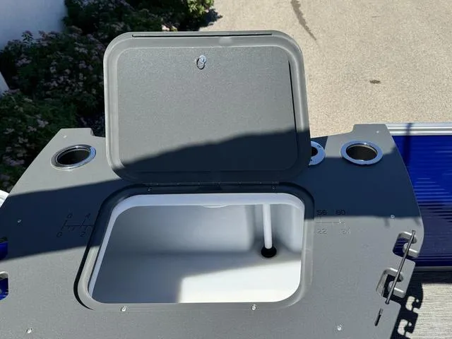 Slide: The Image of Open storage compartment on a 2024 Bennington 20 SVF boat. - 19