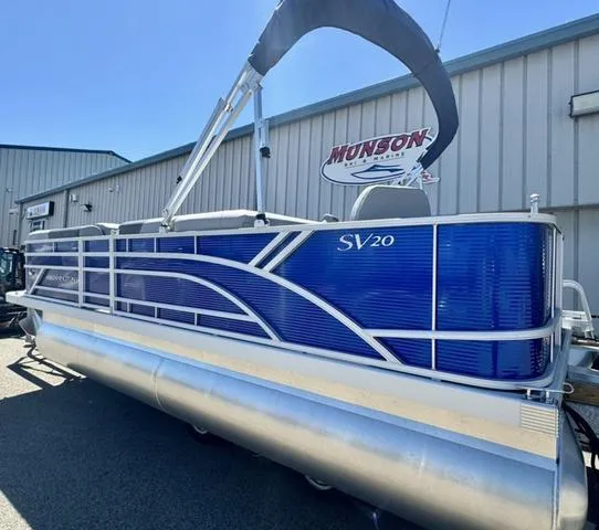Slide: The Image of 2024 Bennington 20 SVF pontoon boat in blue, displayed at Munson Marine. - 4