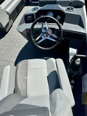 Slide: The Image of 2024 Bennington 20 SVF boat cockpit with steering wheel and captain's chair. - 6