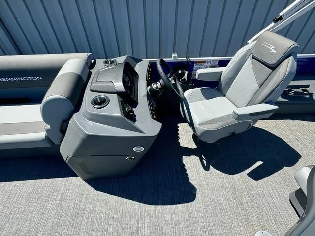 Slide: The Image of 2024 Bennington 20 SVF boat interior with captain's chair and control console. - 8