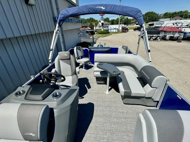 Slide: The Image of 2024 Bennington 20 SVF pontoon boat with spacious seating and canopy. - 9