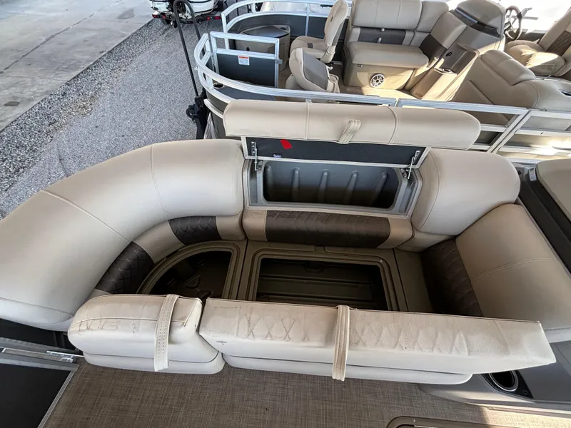 Slide: The Image of 2024 Sun Tracker Party Barge 22 RF XP3 interior seating and storage compartments. - 10