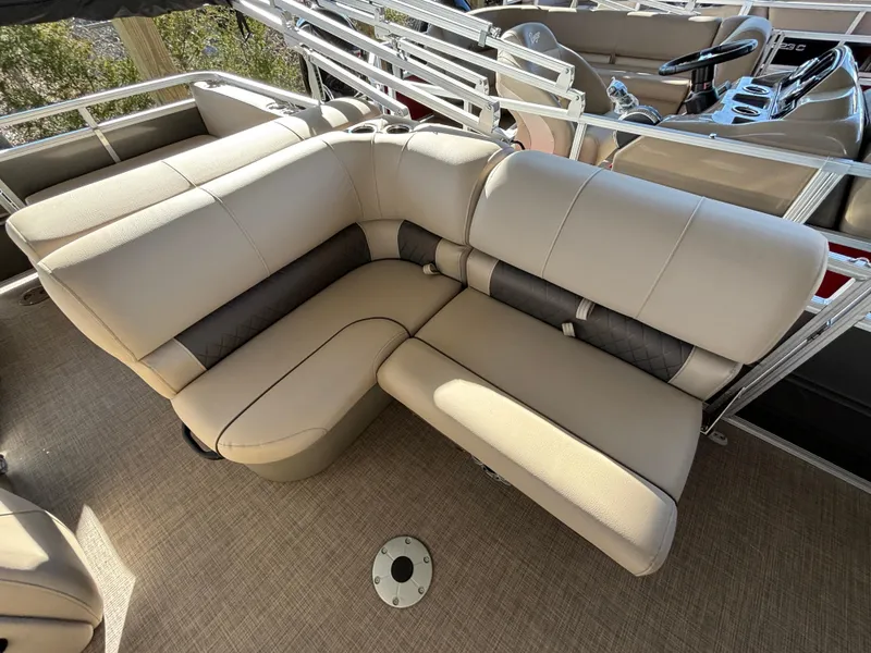 Slide: The Image of 2024 Sun Tracker Party Barge 22 RF XP3 beige seating area with plush cushions. - 12