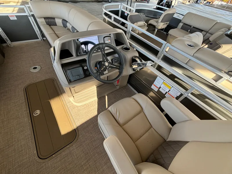Slide: The Image of 2024 Sun Tracker Party Barge 22 RF XP3 interior with helm and seating. - 14