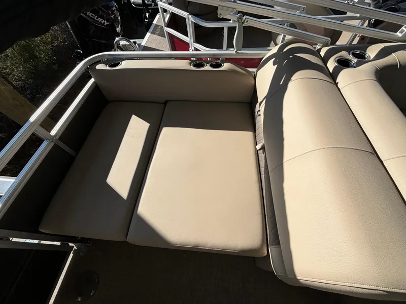 Slide: The Image of 2024 Sun Tracker Party Barge 22 RF XP3 beige seating area with cup holders. - 16