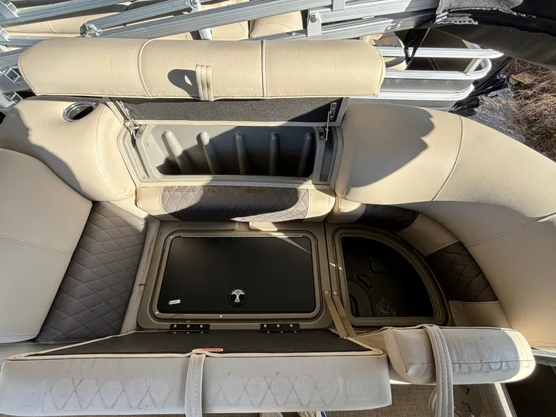 Slide: The Image of 2024 Sun Tracker Party Barge 22 RF XP3 storage compartments and seating area. - 17