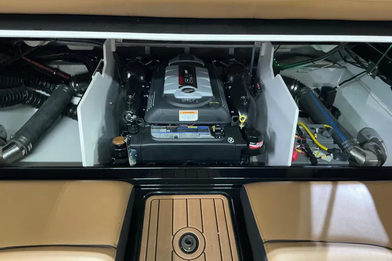 Slide: The Image of 2024 Crownline 240 SS LPX engine compartment showcasing powerful inboard motor and components. - 11
