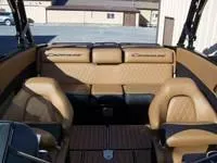Slide: The Image of 2024 Crownline 240LPX boat interior with tan leather seating. - 5