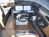Slide: The Image of 2024 Crownline 240LPX boat cockpit with modern steering wheel and dashboard. - 6