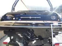 Slide: The Image of 2024 Crownline 240LPX boat rear view with swim platform and ladder. - 7