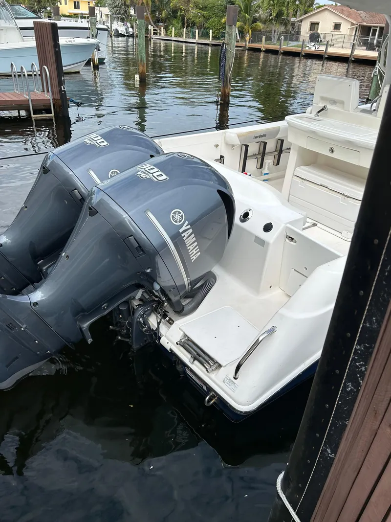 Slide: The Image of 2012 Everglades 295 Center Console boat with twin Yamaha outboard engines. - 17