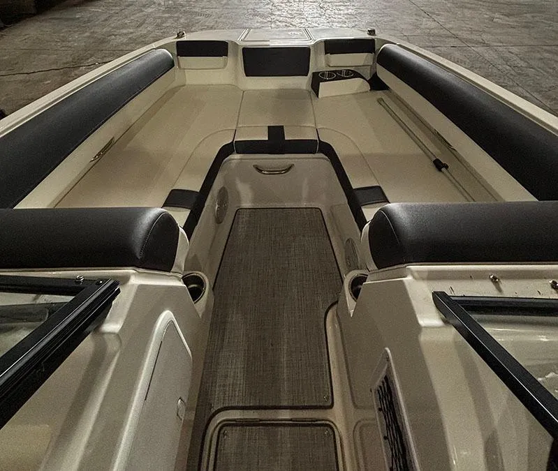 Slide: The Image of 2024 Bayliner DX 2000 boat interior with spacious seating and modern design. - 12