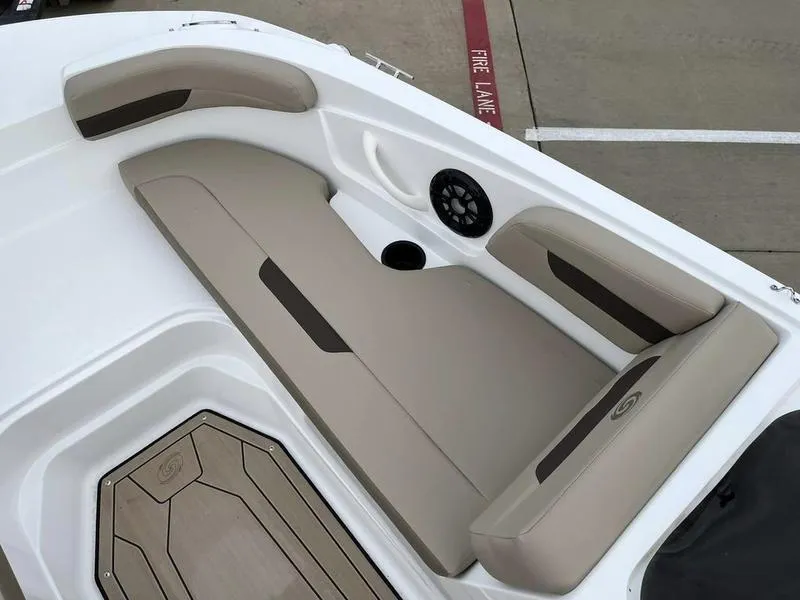 Slide: The Image of 2023 Hurricane SS185-OB boat interior with beige seating and speaker. - 11