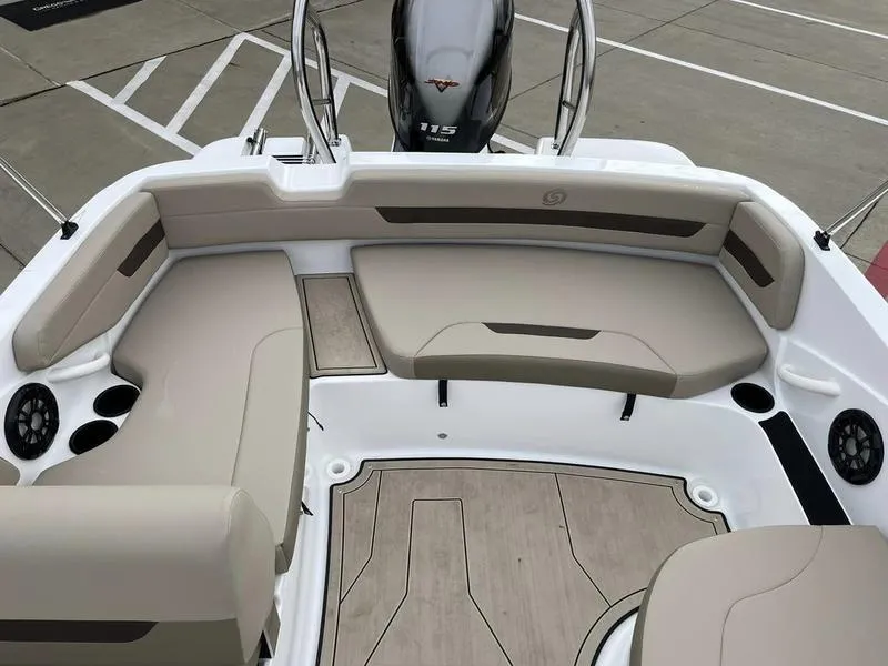 Slide: The Image of 2023 Hurricane SS185-OB boat interior with beige seating and Yamaha 115 outboard motor. - 14
