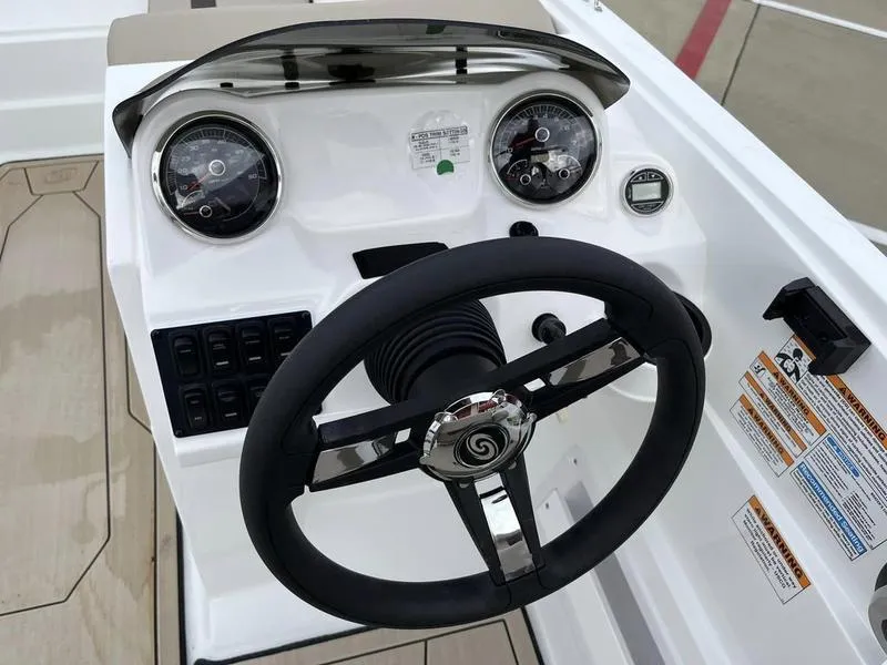 Slide: The Image of 2023 Hurricane SS185-OB boat dashboard with steering wheel and gauges. - 16