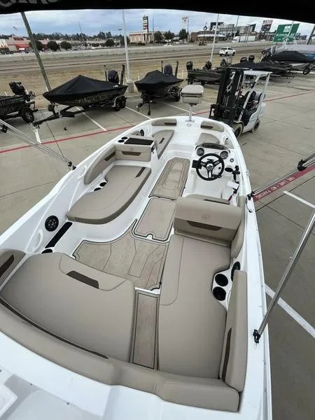 Slide: The Image of 2023 Hurricane SS185-OB boat interior with beige seating and modern design. - 7