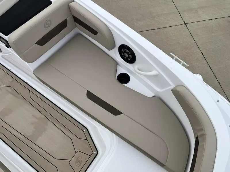 Slide: The Image of 2023 Hurricane SS185-OB boat interior with beige seating and speaker. - 9