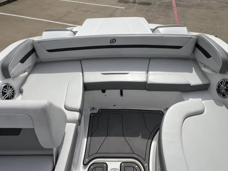 Slide: The Image of 2023 Hurricane SS205-IO 4.5 MPI boat interior with sleek white seating and modern design. - 13