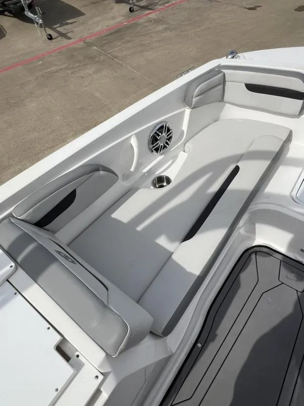 Slide: The Image of 2023 Hurricane SS205-IO 4.5 MPI boat interior with cushioned seating and speaker. - 18
