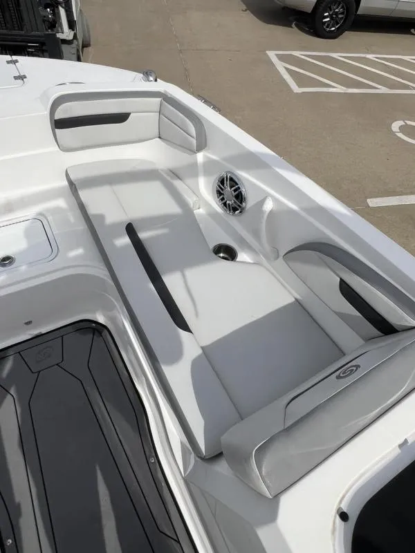 Slide: The Image of 2023 Hurricane SS205-IO 4.5 MPI boat interior with white cushioned seating. - 19