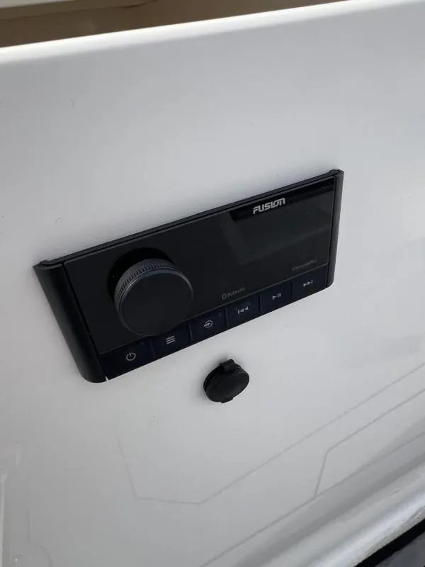 Slide: The Image of Control panel on 2023 Hurricane SS205-IO 4.5 MPI boat, featuring Fusion audio system. - 24