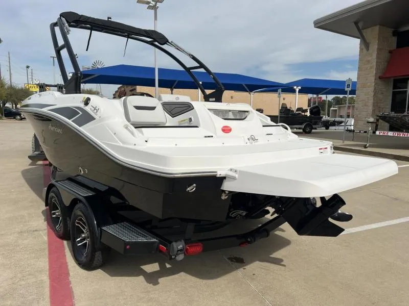 Slide: The Image of 2023 Hurricane SS205-IO 4.5 MPI boat on trailer, parked outdoors. - 3