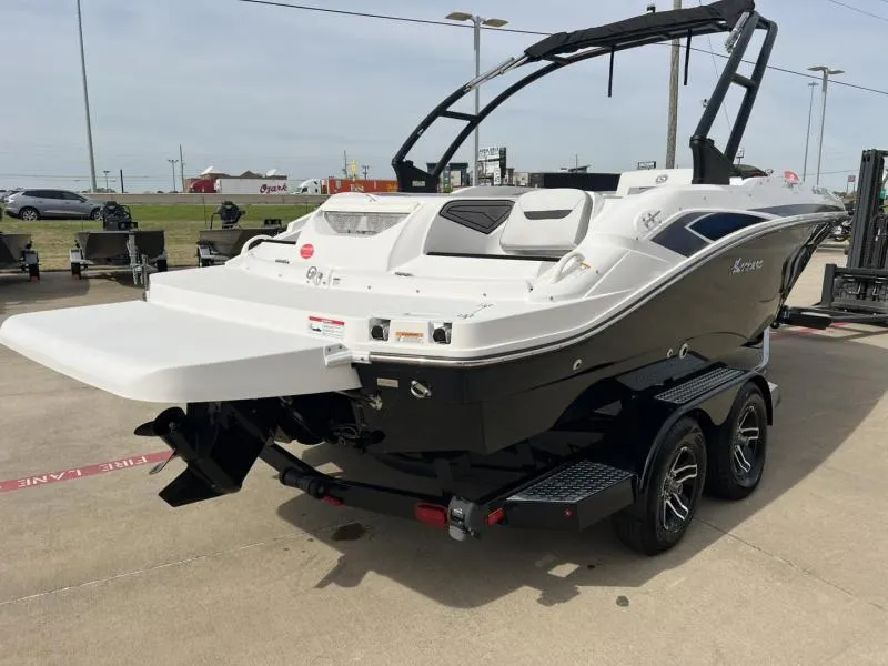 Slide: The Image of 2023 Hurricane SS205-IO 4.5 MPI boat on trailer, displayed outdoors. - 5