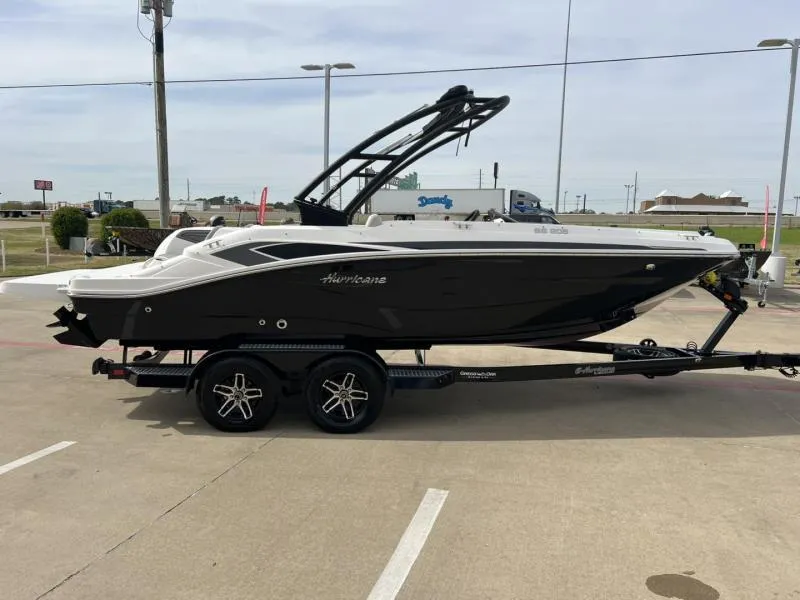 Slide: The Image of 2023 Hurricane SS205-IO 4.5 MPI boat on trailer, parked outdoors. - 6