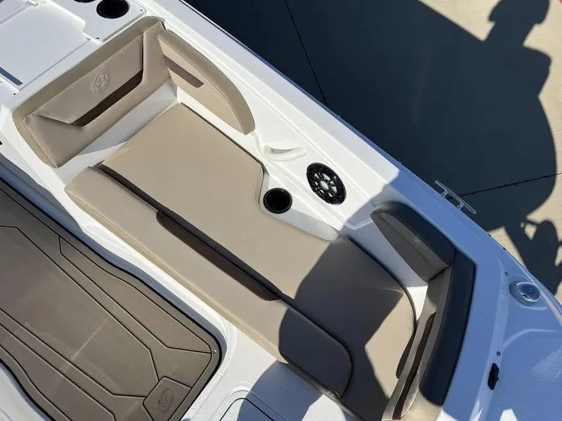 Slide: The Image of 2023 Hurricane SS205-OB boat interior with beige seating and cup holders. - 10