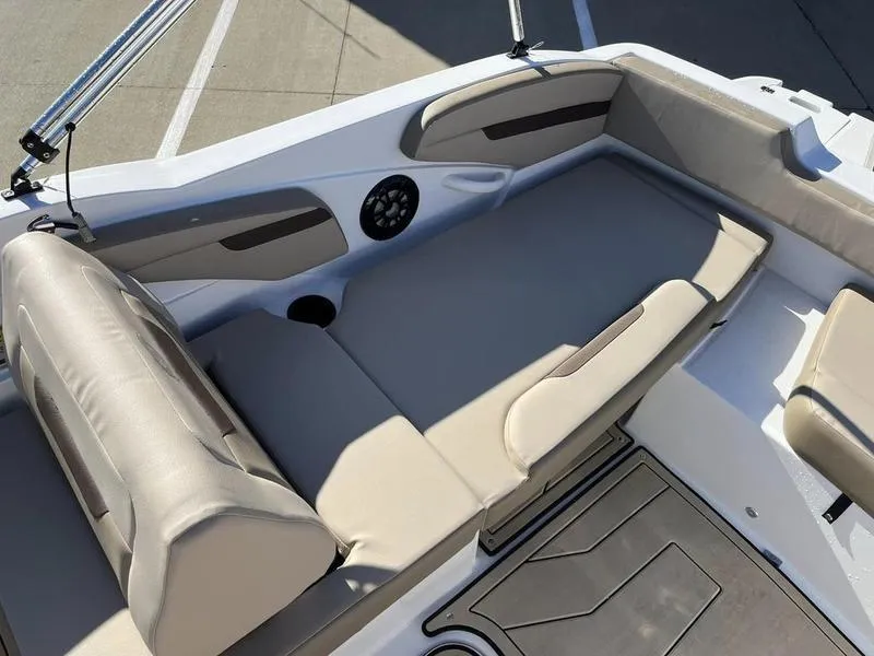 Slide: The Image of 2023 Hurricane SS205-OB boat interior with beige seating and speaker. - 14